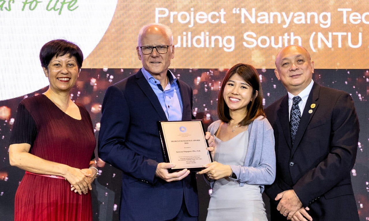 Aurecon Singapore team receives the ACES Design Excellence Merit Award 2024 for their work on NTU Gaia, recognising excellence in sustainable building design, at the ACES 53rd Anniversary Gala Dinner.