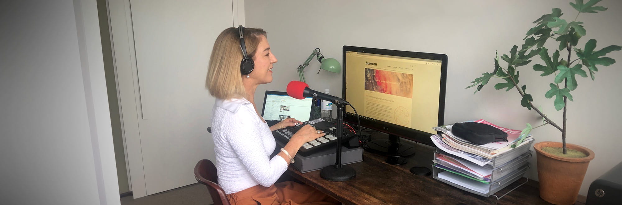 Host Maria Rampa pictured recording the podcast at her home office.