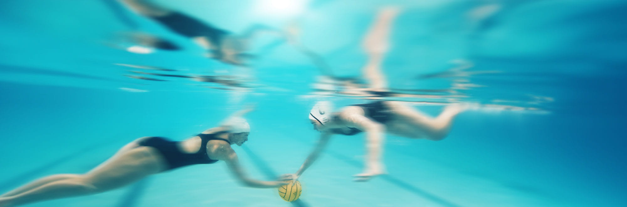 Female water polo players fetching ball from under water. Presenter images overlayed, order top to bottom: Taryn Woods, Christine McLoughlin.